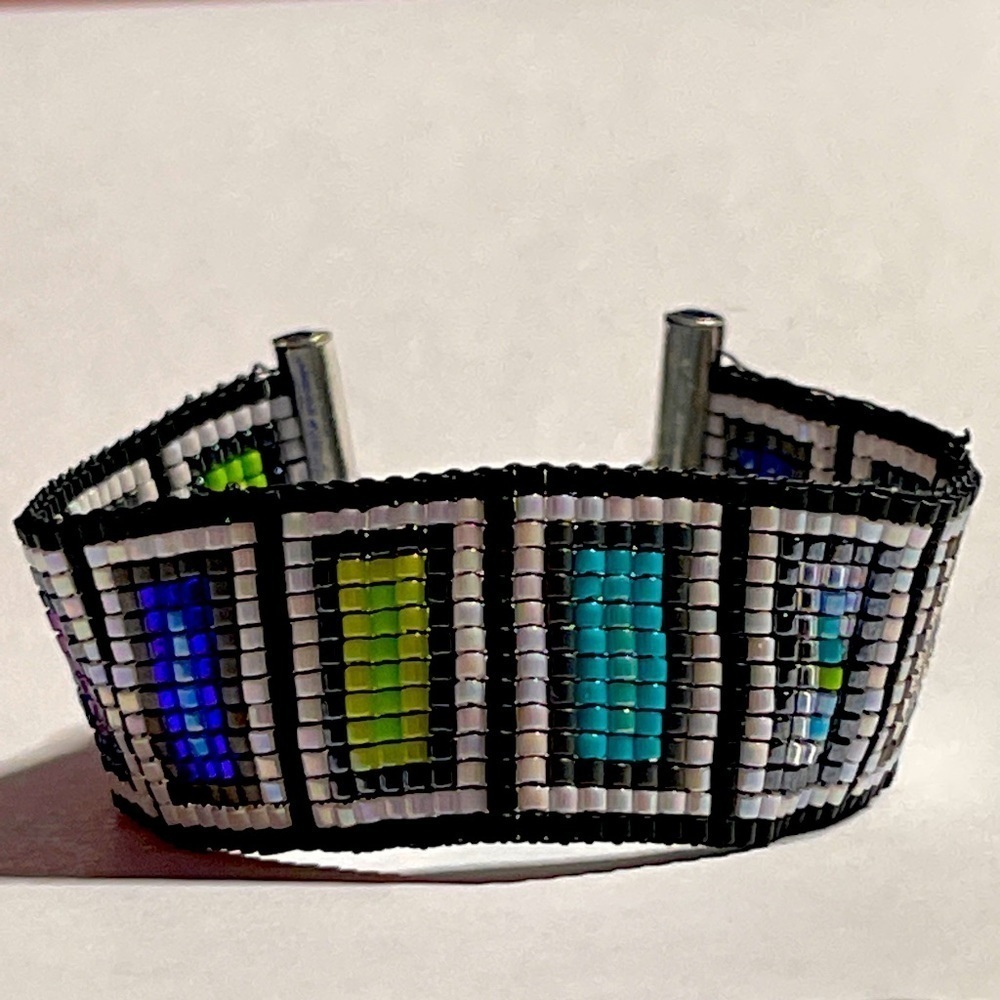 Handcrafted on a loom is this bracelet named “Flattened.”